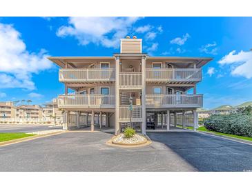 Inviting multi-story beach condo with covered parking and private balconies offering stunning ocean views at 1801 N Ocean Blvd. # A4, North Myrtle Beach, SC 29582