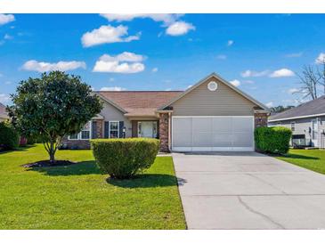 Charming single-story home featuring a well-maintained lawn, two-car garage, and attractive landscaping at 466 Wampee St. Nw, Calabash, NC 28467