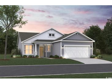 Charming single-story home featuring gray siding, white trim, a two-car garage, and a well-maintained lawn at 368 Kapalua Loop, Little River, SC 29566