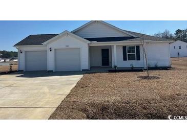 Charming single-Gathering home with a two-car garage and well-maintained lawn at 985 Cherrystone Loop, Conway, SC 29526