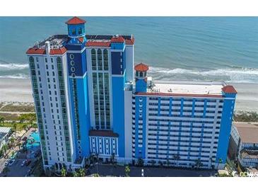 A blue and white ocean front resort with balconies, a pool, and a sandy beach at 3000 N Ocean Blvd. # 729, Myrtle Beach, SC 29577