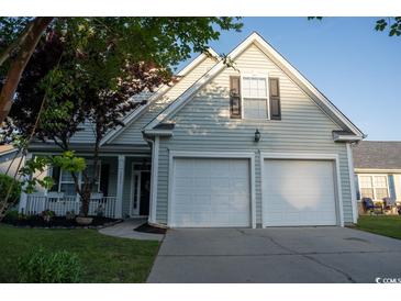 Charming two-story home featuring a two-car garage and a welcoming front porch at 2039 Chadbury Ln., Myrtle Beach, SC 29588