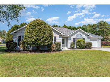 Charming single-story home with a well-manicured lawn, lush landscaping, and inviting curb appeal at 2654 Wild Game Trail, Myrtle Beach, SC 29588