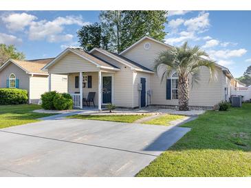 Charming single-story home featuring a well-manicured lawn, covered porch, and ample parking space in the driveway at 3012 Sabal Ct., Murrells Inlet, SC 29576