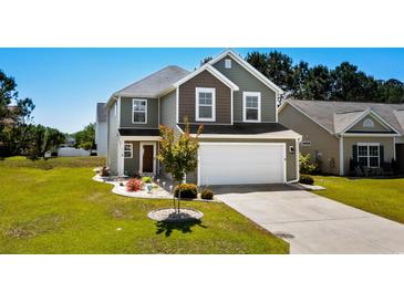 Charming two-story home with a two-car garage and manicured lawn in a suburban neighborhood at 356 Whipple Run Loop, Myrtle Beach, SC 29588