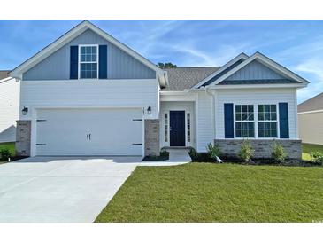 Charming single-Gathering home featuring a two-car garage and manicured lawn at 419 Lifestyle Court, Surfside Beach, SC 29575