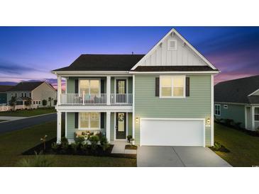 Charming two-story home boasting a welcoming porch and a two-car garage at 101 Cowan Pl., Myrtle Beach, SC 29588