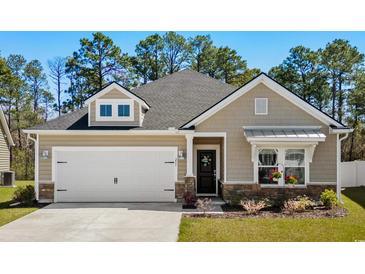 Charming single-Gathering home featuring a 2-car garage, neutral color palette, and manicured lawn at 255 Augusta Green Way, Myrtle Beach, SC 29579