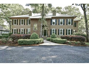 Traditional two-story home with brick and siding, dormers and mature landscaping at 273 Golden Bear Dr. # F3, Pawleys Island, SC 29585
