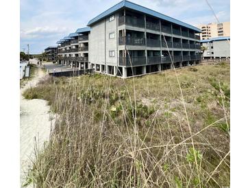 Seaside condos on stilts offer covered parking and scenic views of the beach at 6000 Ocean Blvd. N # 108, North Myrtle Beach, SC 29582
