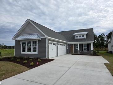 Charming single-Gathering home with a three car garage and gray siding at 414 Starlit Way, Myrtle Beach, SC 29579