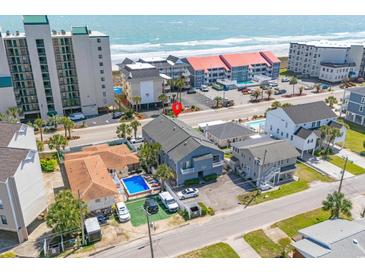 Aerial view showcasing a home with a private pool near the ocean at 4504 S Ocean Blvd. # A, North Myrtle Beach, SC 29582