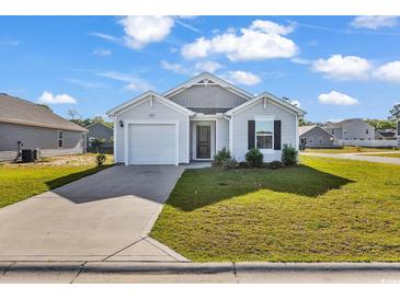 Charming single-story home with a well-maintained lawn and an attached one car garage at 500 Dundalk Dr., Conway, SC 29526