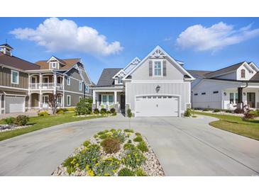 Charming home featuring a two-car garage, well-manicured lawn, and beautiful front yard landscaping at 756 Waterbridge Blvd., Myrtle Beach, SC 29579