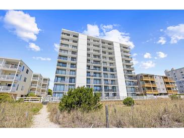 Bright white condo building with private balconies offering stunning views of the beautiful blue sky at 4311 S Ocean Blvd. # 701, North Myrtle Beach, SC 29582