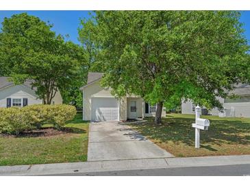 Charming one-story home with a well-manicured lawn and mature trees at 622 Oakhurst Dr., Myrtle Beach, SC 29579