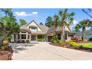 Charming home featuring stone accents, a well-manicured lawn, and a spacious driveway, perfect for curb appeal at 8008 Mcsweeney Ct., Myrtle Beach, SC 29588