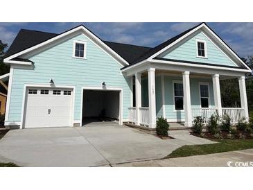 Charming coastal-style home with a welcoming front porch and attached two-car garage at 1407 Lancaster Way, Myrtle Beach, SC 29588