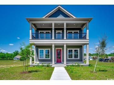 Charming two-story home featuring a double porch, stylish columns, and a beautifully landscaped front yard at 468 Saint Julian Ln., Myrtle Beach, SC 29579