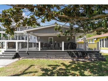 Inviting covered back deck features outdoor seating, perfect for entertaining or relaxing outdoors at 6001-Mh409 S Kings Hwy., Myrtle Beach, SC 29575