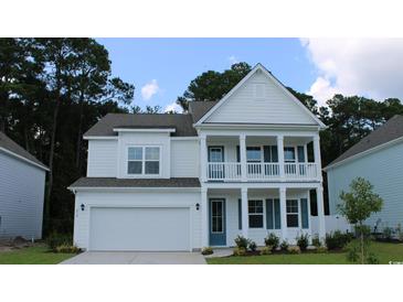 Charming two-story home with a welcoming porch and a well-manicured lawn, showcasing curb appeal at 745 Choctaw Dr., Conway, SC 29526