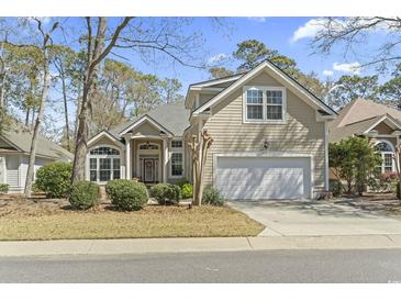 Charming two-story home with a two-car garage and well-maintained landscaping at 929 Tidewater Dr., North Myrtle Beach, SC 29582