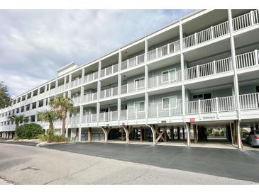 Coastal condo complex featuring multiple floors and private balconies, elevated on pilings at 9581 Shore Dr. # 223, Myrtle Beach, SC 29572