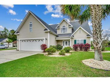 Charming home with a well-manicured lawn, attached garage, and mature landscaping and inviting curb appeal at 1001 Harvest View Ave., Conway, SC 29527