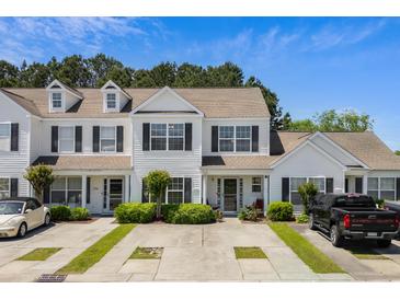 Charming townhomes featuring manicured landscaping and convenient parking at 1004 Harvester Circle # 1004, Myrtle Beach, SC 29579