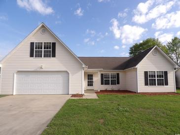 Charming single-Gathering home with a well-maintained lawn, attached garage and classic design at 108 Pickerel Blvd., Longs, SC 29568