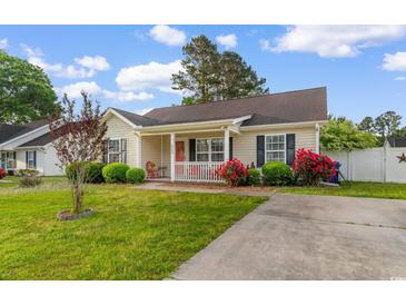 Charming single-story home with a cozy front porch and well-maintained landscaping at 2446 Farmwood Circle, Conway, SC 29527