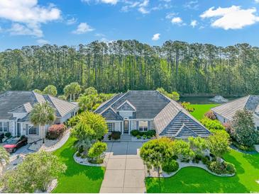 Stunning aerial view of the home showcasing landscaped front yard and beautiful surroundings at 178 Kessinger Dr., Surfside Beach, SC 29575