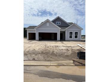 New construction two-car garage home with gray siding and architectural shingle roof at 186 Glengrove Lane, Murrells Inlet, SC 29576