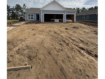 New construction home featuring light blue siding and a two-car garage at 187 Glengrove Lane, Murrells Inlet, SC 29576