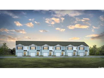 Charming exterior view of townhomes featuring light blue siding, black shutters, and well-manicured lawn at 330 Bayou Loop # Lot 68, Surfside Beach, SC 29575