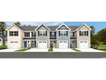 Charming townhomes showcase a modern design with attached garages and colorful front doors at 3208 Nw Edgemead Circle # B, Calabash, NC 28467