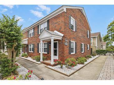 Charming brick exterior featuring manicured landscaping and a welcoming entrance with white columns at 401 77Th Ave. N # 11, Myrtle Beach, SC 29572