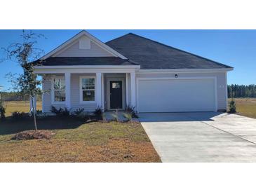 Charming one-story home with a two-car garage and beautiful landscaping at 619 Culmen Ct., Myrtle Beach, SC 29588