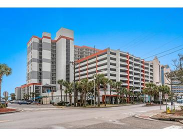 Multi-story condo building with palm trees and street view, featuring a parking garage with multiple levels at 7200 N Ocean Blvd. # 431, Myrtle Beach, SC 29572