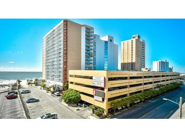 View of the Sands Ocean Club building complex and parking garage with ocean and blue sky in background at 9550 Shore Dr. # 531, Myrtle Beach, SC 29572