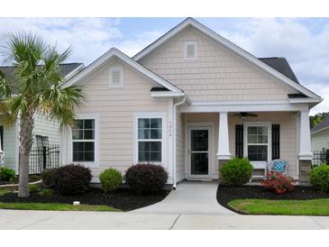 Charming single-story home featuring a manicured lawn and a welcoming covered front porch at 1308 Riverport Dr., Conway, SC 29526