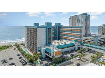 A view of the Landmark Resort with a large building near the beach and the beach across the street at 1501 S Ocean Blvd. # 1044, Myrtle Beach, SC 29577