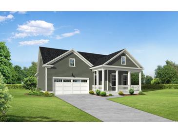 Charming single-Gathering home featuring a covered porch, attached garage, and beautifully landscaped yard at 5027 Whitsett St., Murrells Inlet, SC 29576