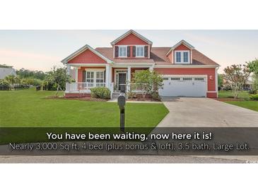 Charming two-story home with a well-manicured lawn and attached two-car garage at 632 Serendipity Circle, Murrells Inlet, SC 29576