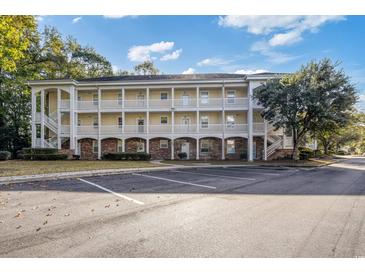 Inviting condo with a classic exterior, well-maintained landscaping, and convenient parking at 679 Riverwalk Dr. # 202, Myrtle Beach, SC 29579