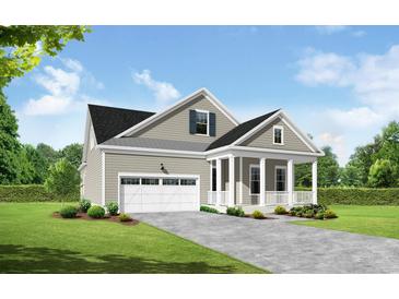 Charming single-Gathering home featuring a welcoming front porch, an attached garage, and a beautifully landscaped front yard at 9055 Binnicker Dr., Murrells Inlet, SC 29576