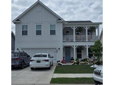 Charming two-story home with a welcoming front porch and well-manicured landscaping at 1295 Safe Haven Dr., Myrtle Beach, SC 29579