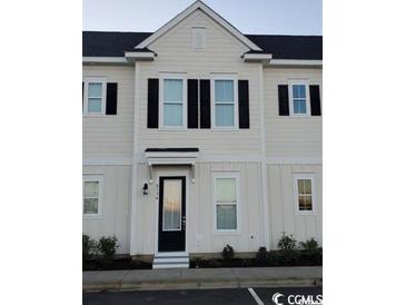 Charming two-story home features a black front door, black shutters, and a well-maintained exterior at 2800 Cook Circle # C, Myrtle Beach, SC 29577