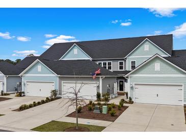 Charming townhomes feature attached garages, well-manicured landscaping and neutral exterior paint at 5371 Knobcone Loop # D, Myrtle Beach, SC 29577
