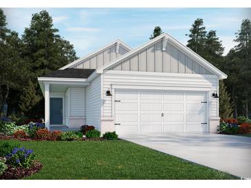 Charming single-Gathering home featuring a two-car garage, complemented by well-manicured landscaping and a welcoming entrance at 900 Cypress Preserve Circle, Longs, SC 29568